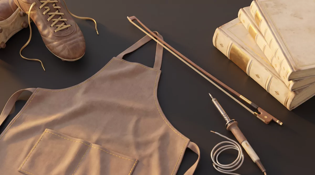 Overhead flat-lay on a dark matte surface of objects representing different pursuits, a worn soccer 
