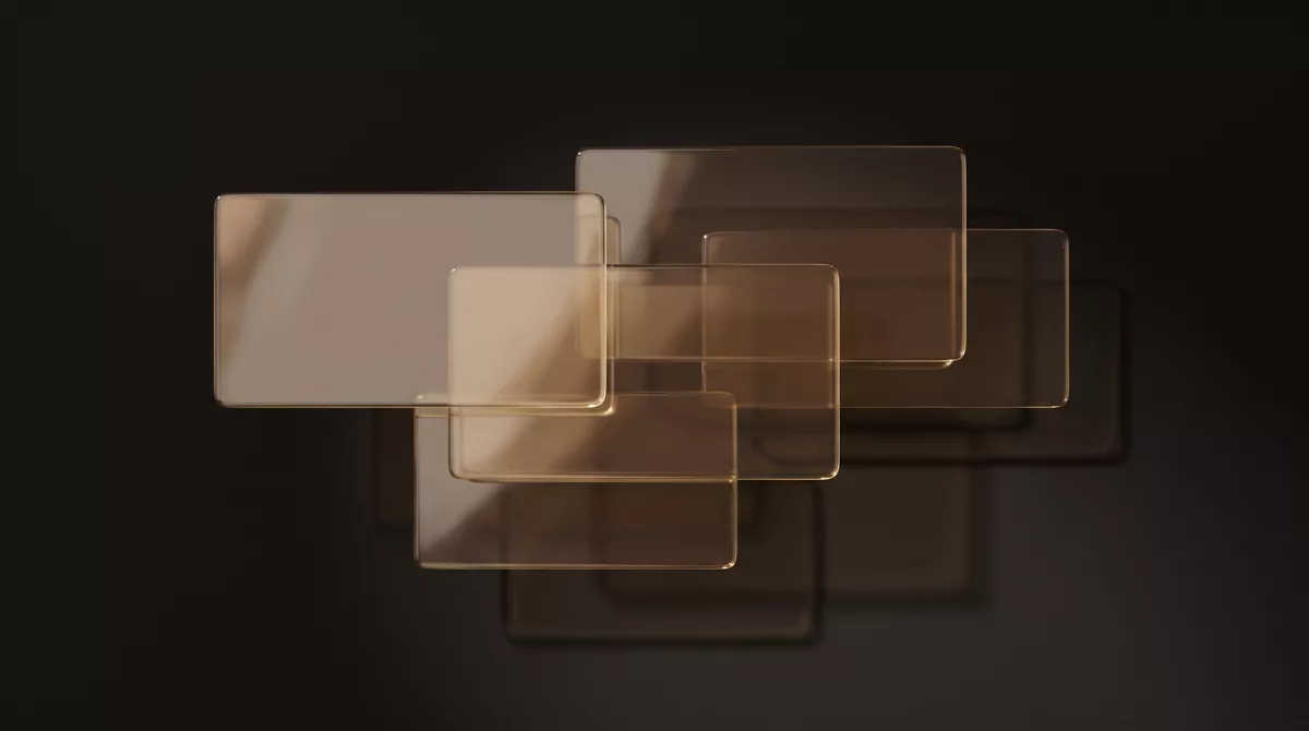 Five overlapping panes of amber-tinted glass suspended against a near-black background, slightly mis