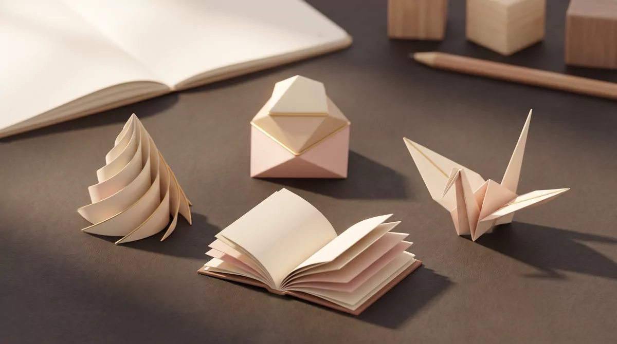 Four folded paper shapes arranged on a dark surface under warm directional light, each folded differ
